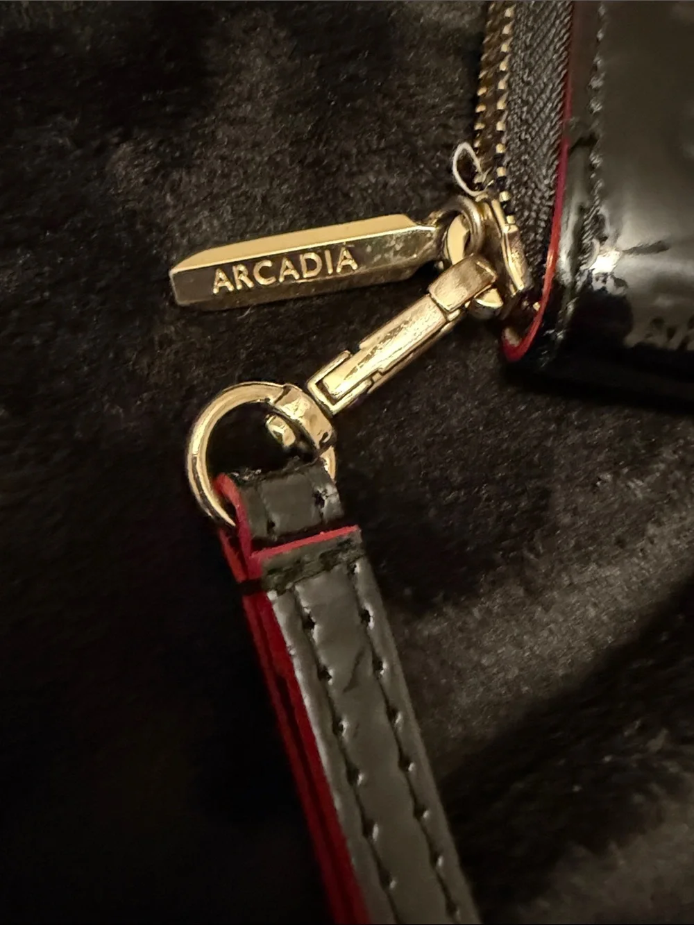 Arcadia Black Patent Zip-Around Phone Wristlet with Red Strap